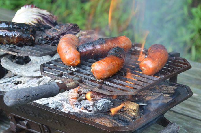Flaming Hibachi grilling Italian sausages